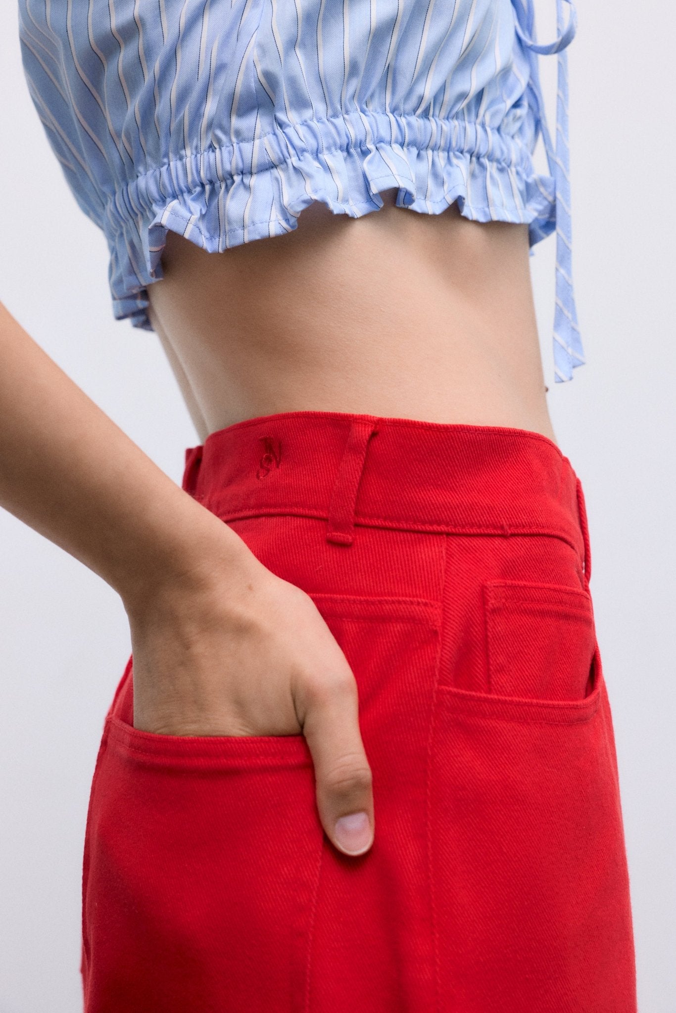 Our classic wide-leg pants crafted from soft 100% cotton denim, now available in a beautiful red shade that adds character and style to any outfit.
