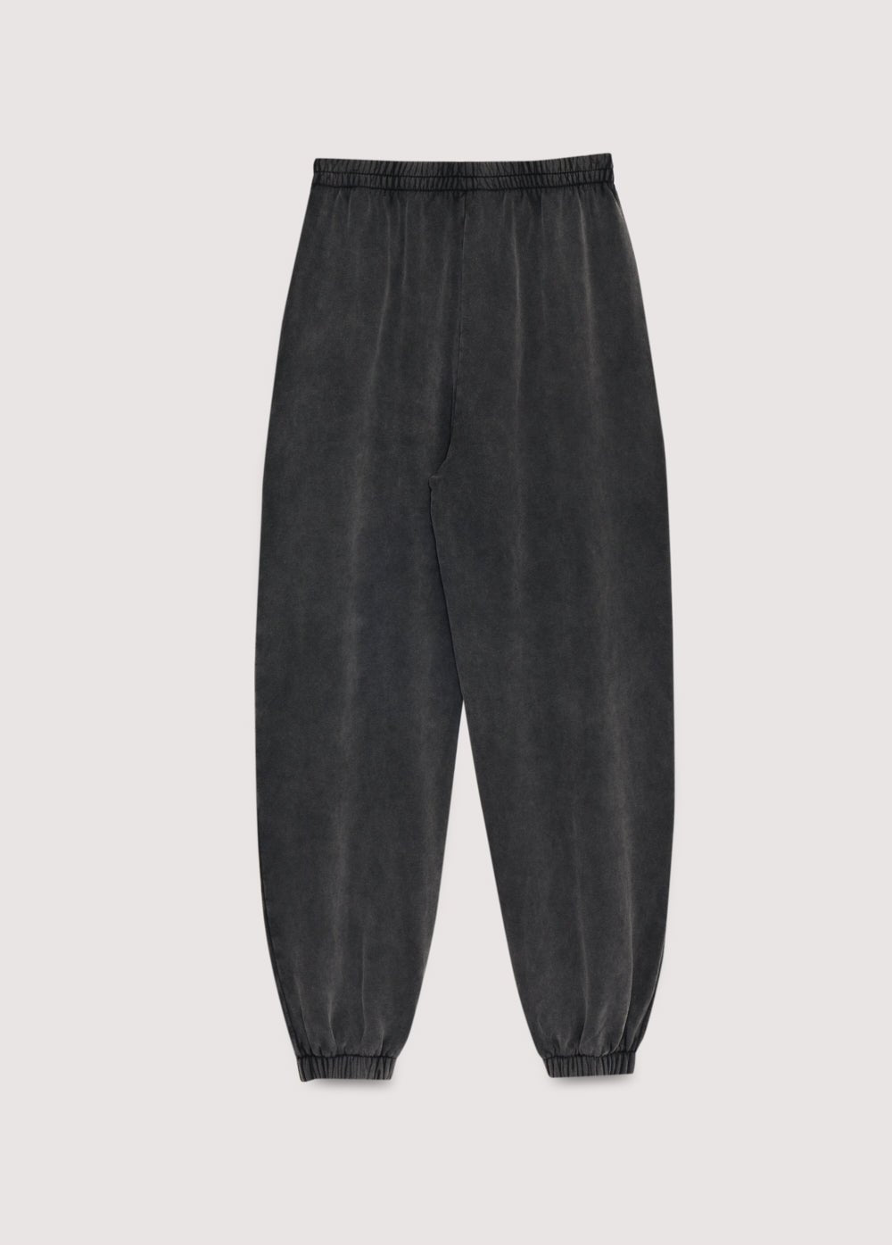 Pantalón jogger de felpa gris lavado con cinturilla y puños elásticos. Perfecta para un total look con la sudadera a juego.
