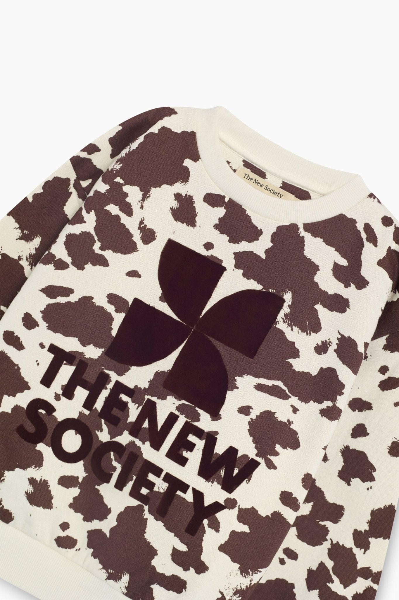 TNS-Logo-Sweatshirt mit Kuh-Print