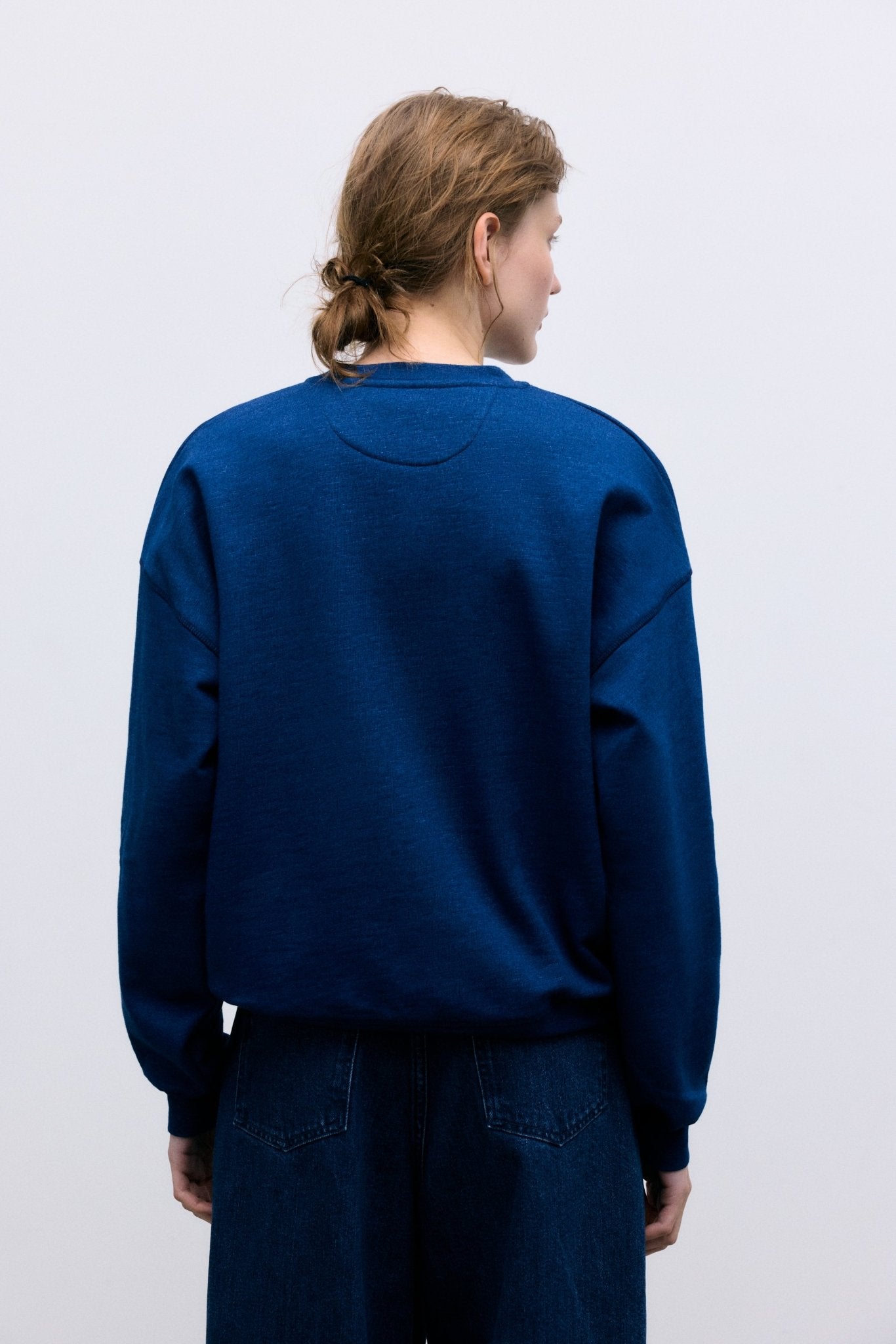 Bestselling sweatshirt in soft cotton fleece with a smooth, cozy finish. Features a contrasting TNS brand logo on the front, perfect for everyday wear.