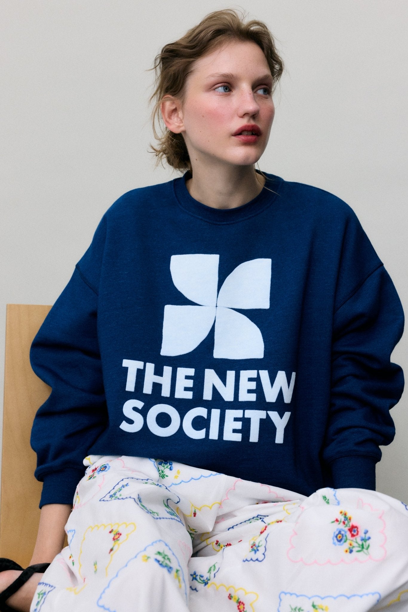 Bestselling sweatshirt in soft cotton fleece with a smooth, cozy finish. Features a contrasting TNS brand logo on the front, perfect for everyday wear.