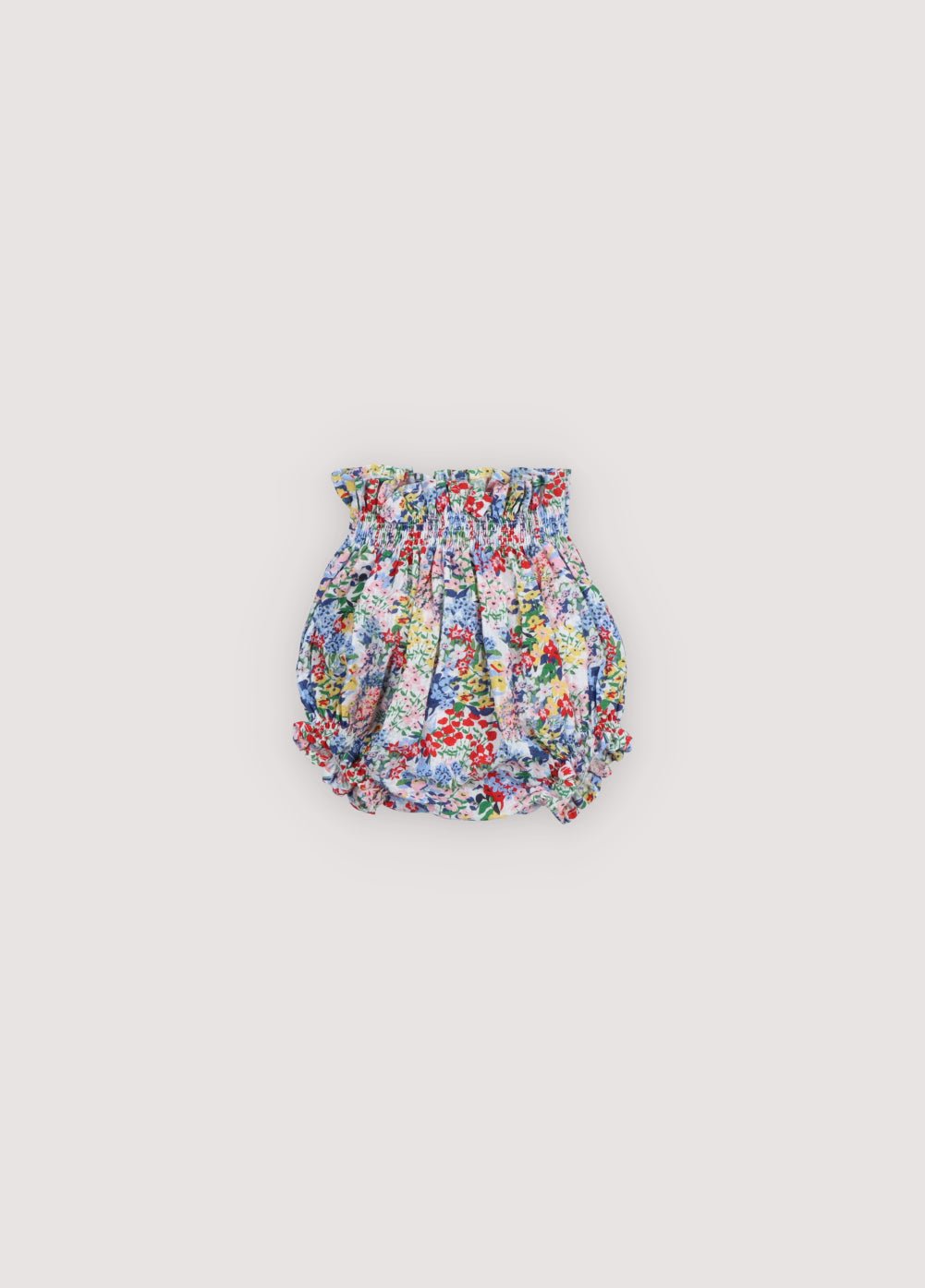 Seersucker cotton bloomer featuring a lovely floral print, elasticated waistband and leg openings, and finished with delicate ruffles for a soft, charming look.