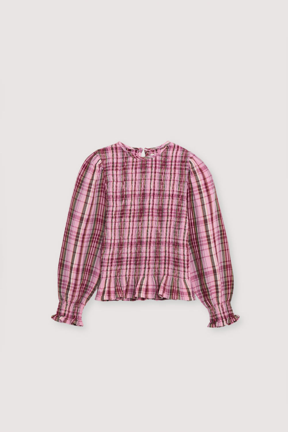 Checkered double gauze blouse with a smocked bodice and ruffle trim at the hem. It features slightly puffed sleeves and a back opening with a teardrop-shaped cut and button closure. Comes with a matching skirt to complete the look.