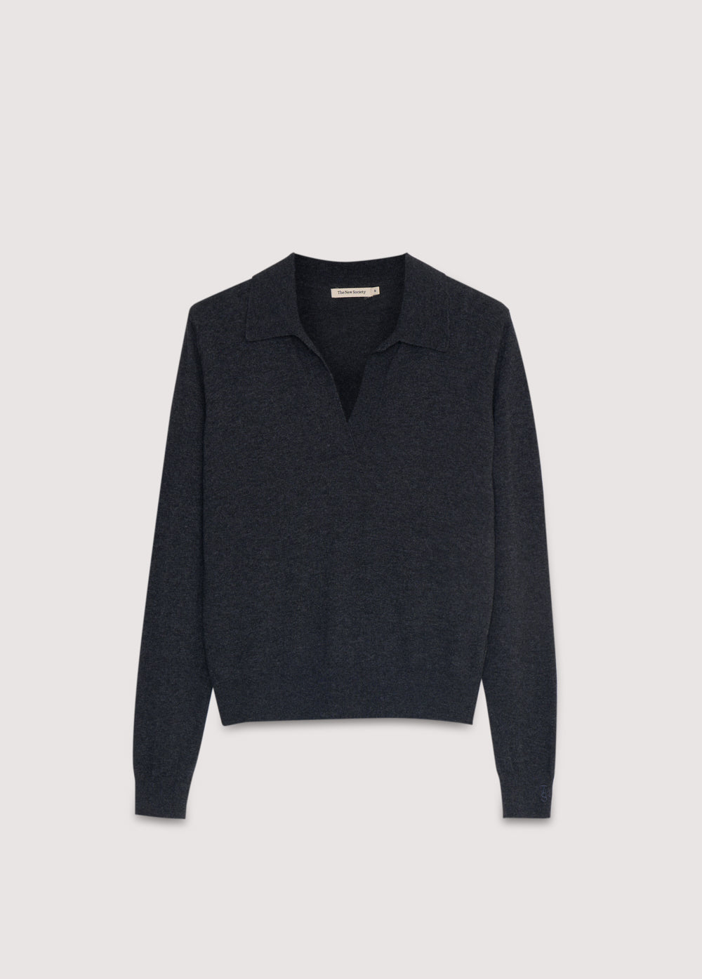 Fine-knit polo in cashmere and wool, with ribbed cuffs and hem, and a ribbed collar with a button placket.