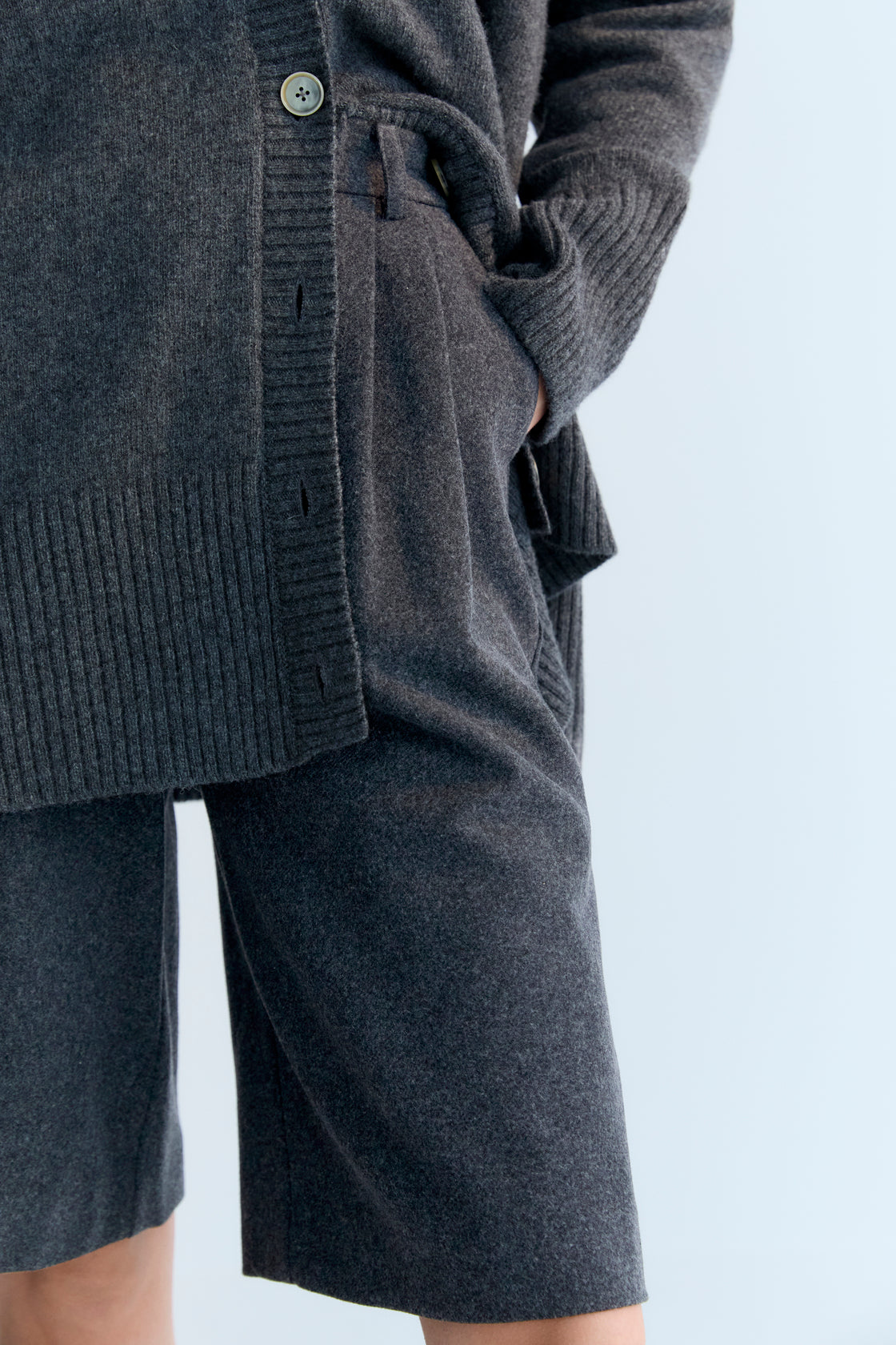 Oversized cashmere knit cardigan with tone-on-tone buttons.