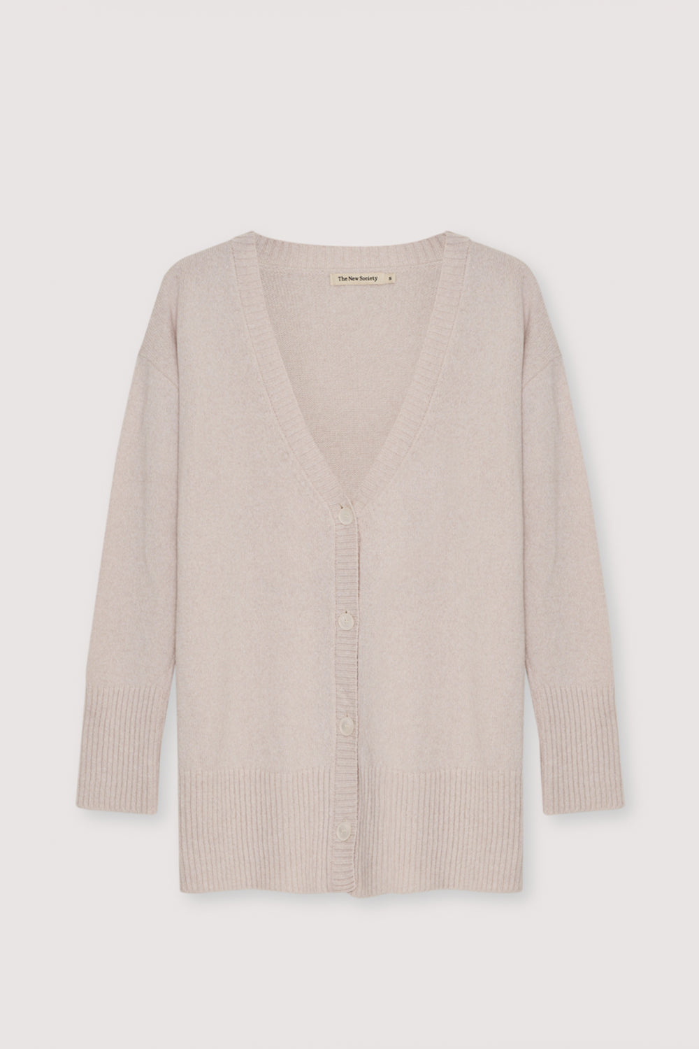 Oversized cashmere knit cardigan with tone-on-tone buttons.