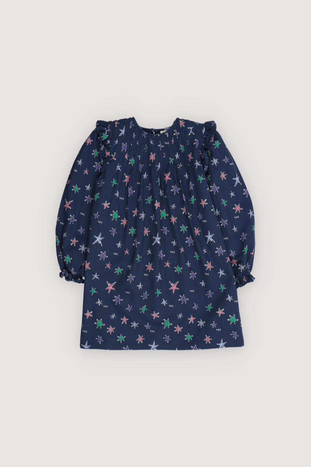 This short flannel dress in the Althea Print features a vibrant, all-over star pattern that brings color and charm to cooler days