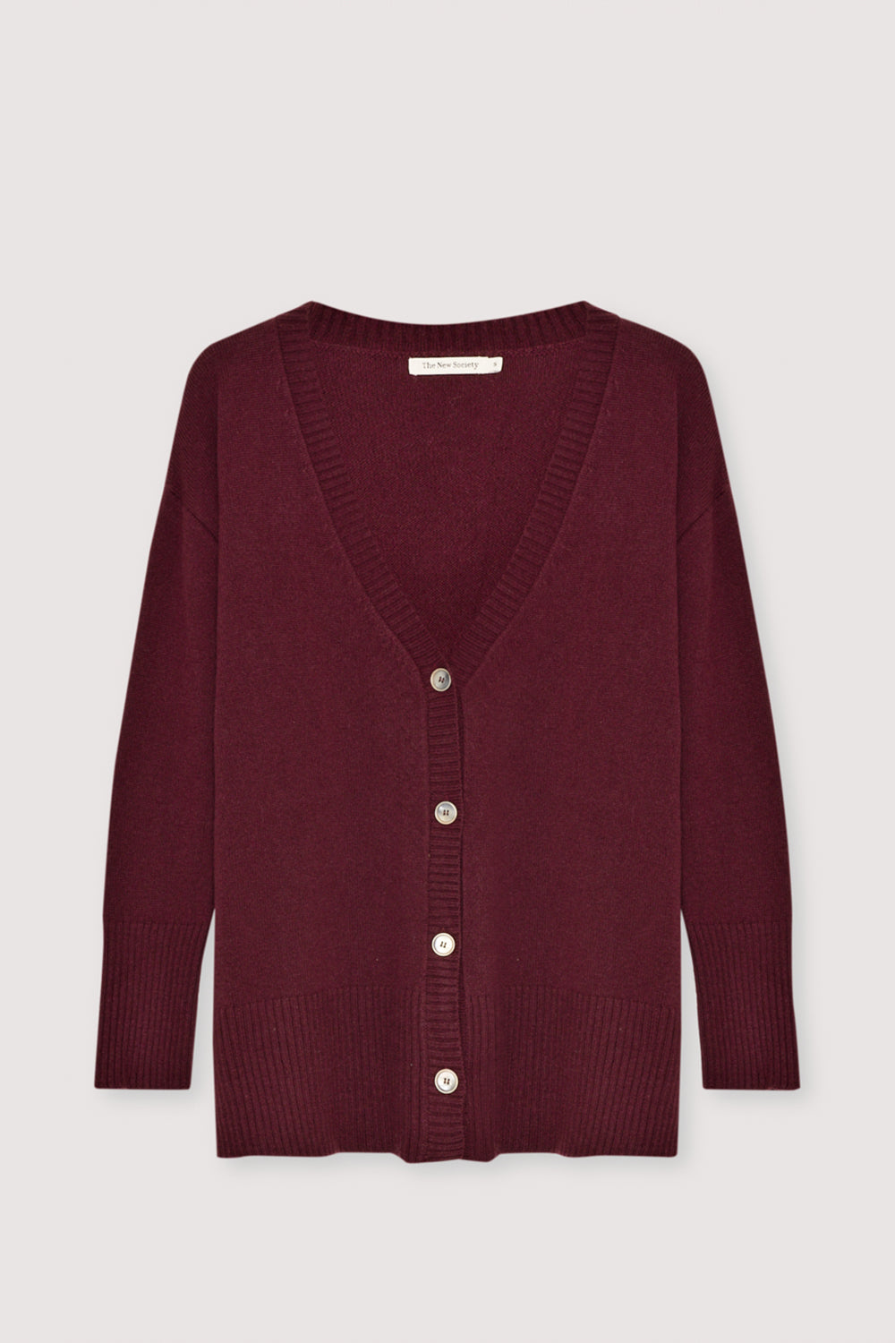 Oversized cashmere cardigan crafted for a relaxed, cozy fit, featuring tone-on-tone buttons for a clean, minimalist look. Perfect for layering, it combines luxurious softness with effortless style for everyday wear.