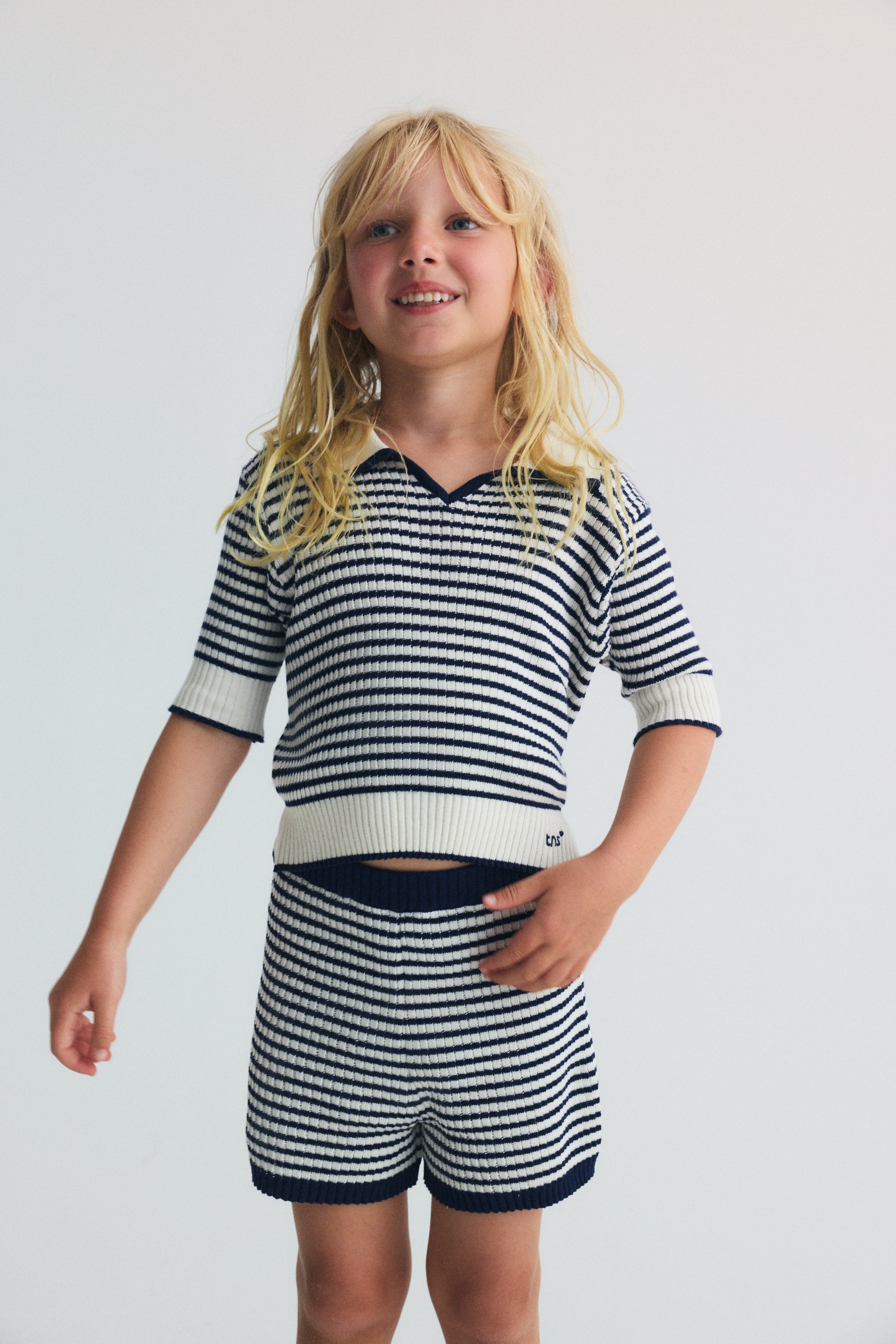 A lightweight knit polo with classic sailor style stripes and a subtle branded embroidery on the rib.