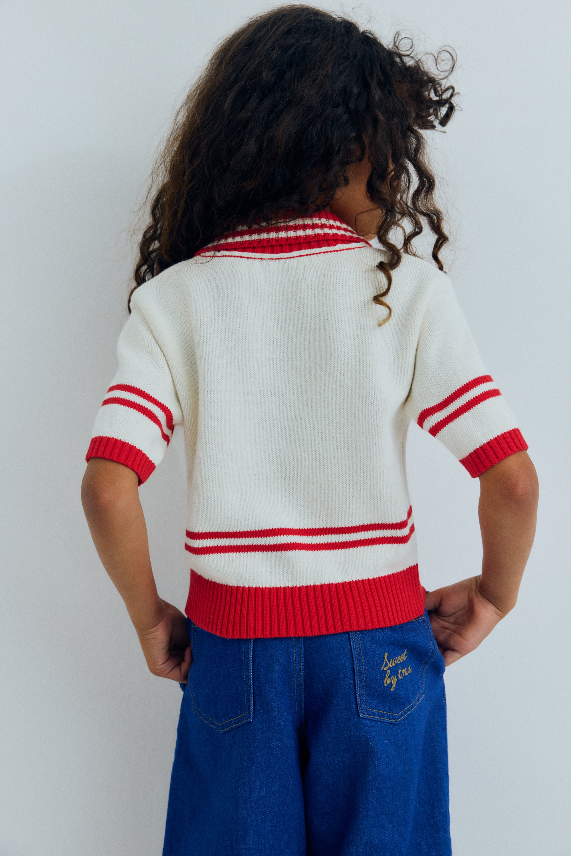 A lightweight knit polo featuring contrast trims and a new branded logo embroidered on the chest for a subtle, stylish touch.