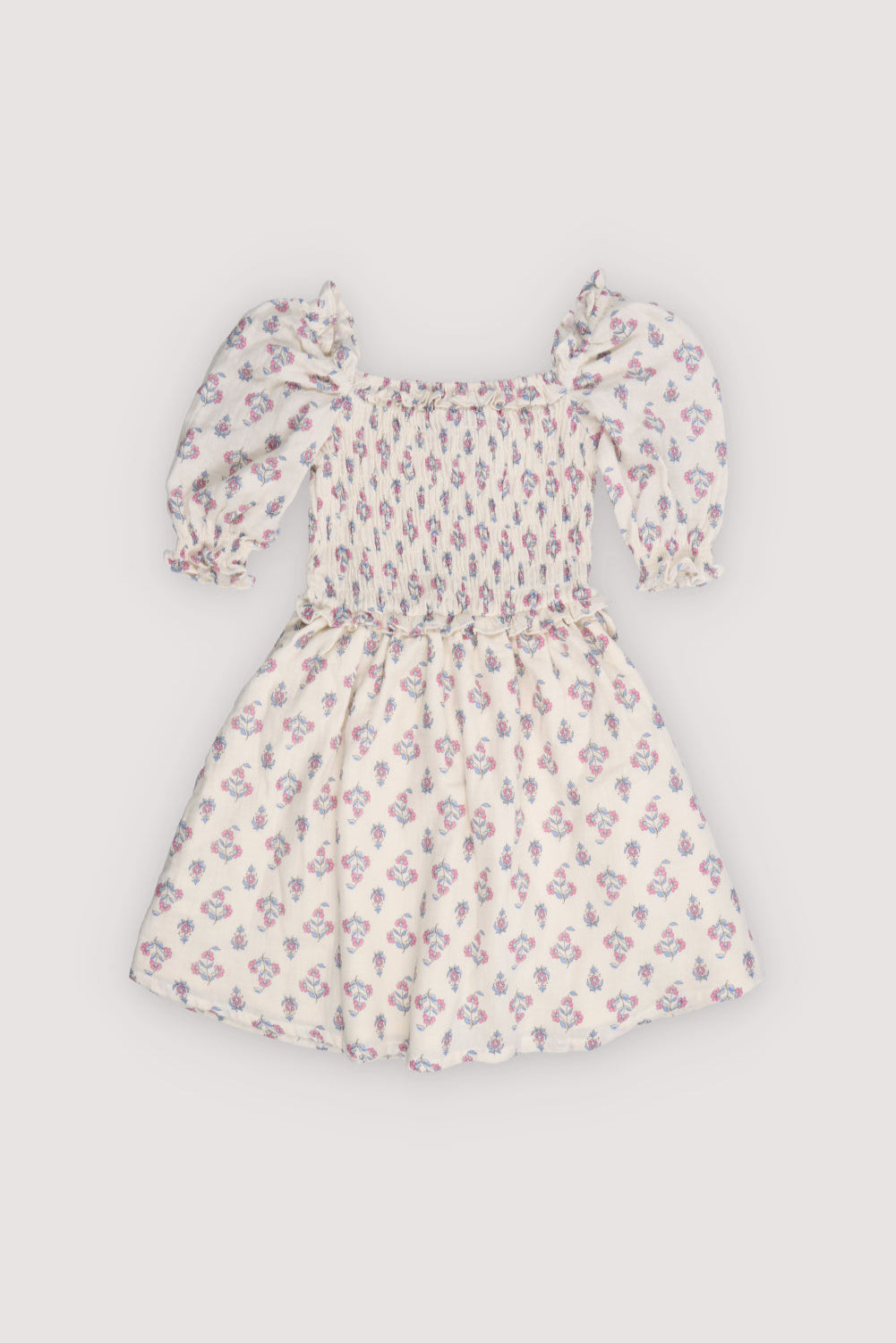 Dress in soft 100% cotton with a charming seal print, smocked bodice, and double-layered ruffle skirt.