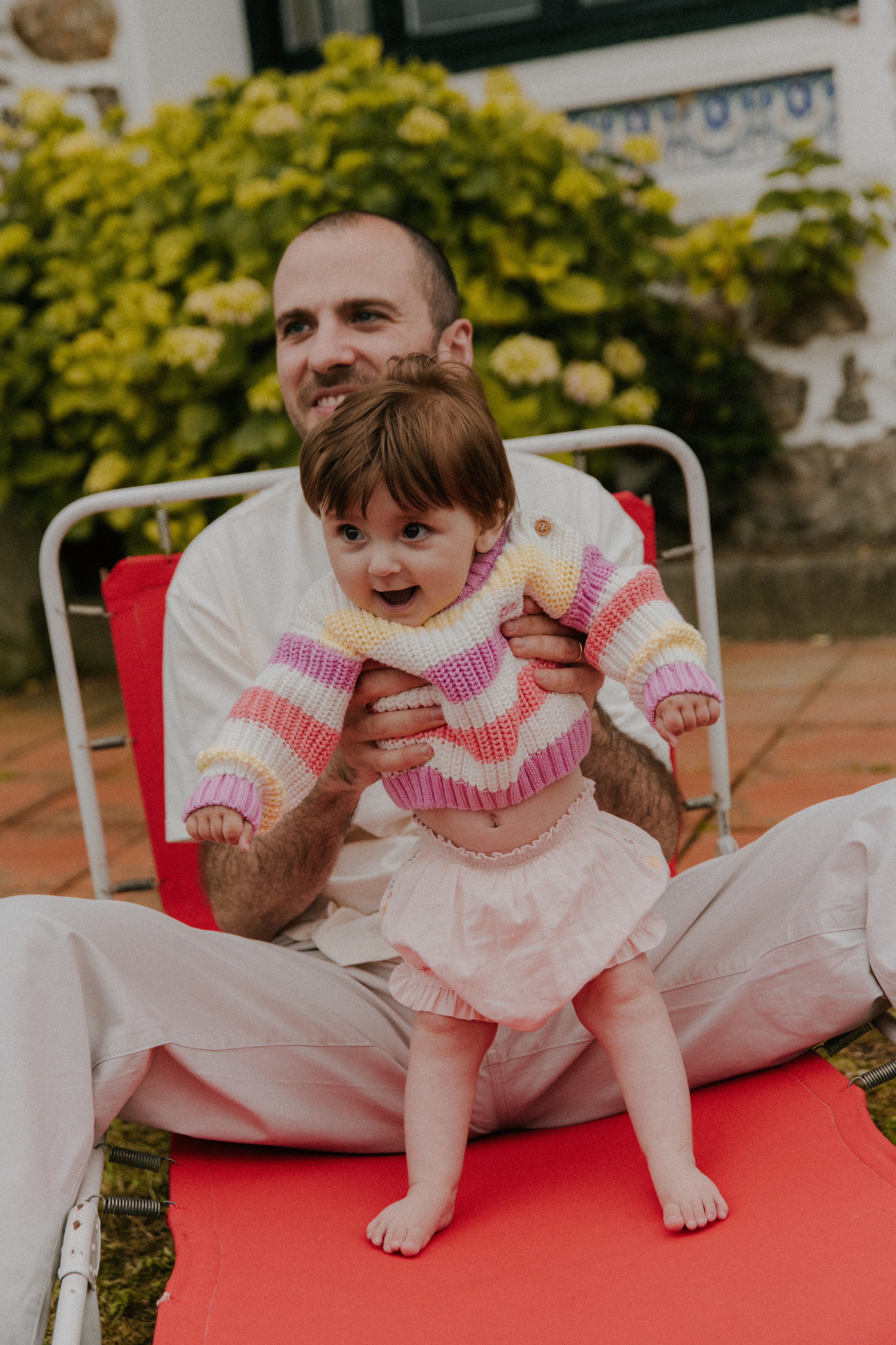 Baby striped cotton knit featuring fresh, summery colors and a charming embroidered logo detail on the chest