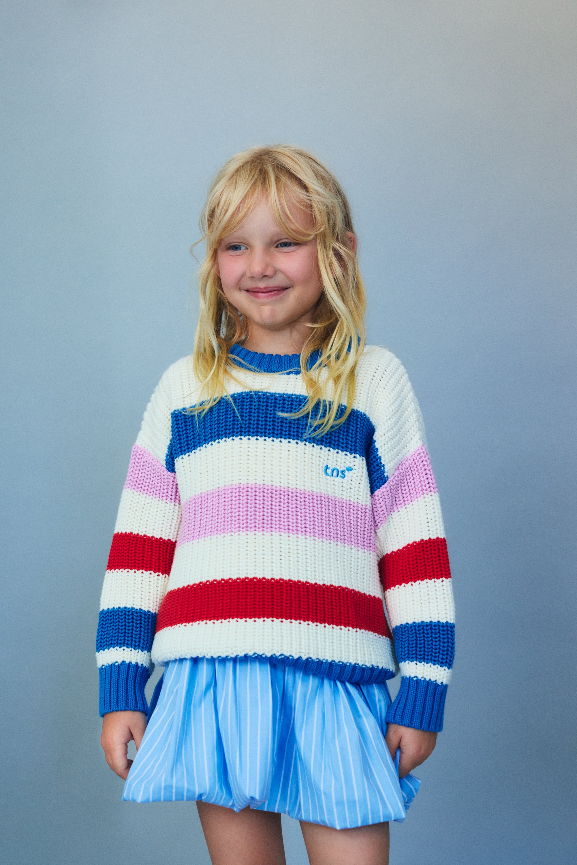 Our classic striped cotton knit featuring fresh summery colors and a charming embroidered logo detail on the chest