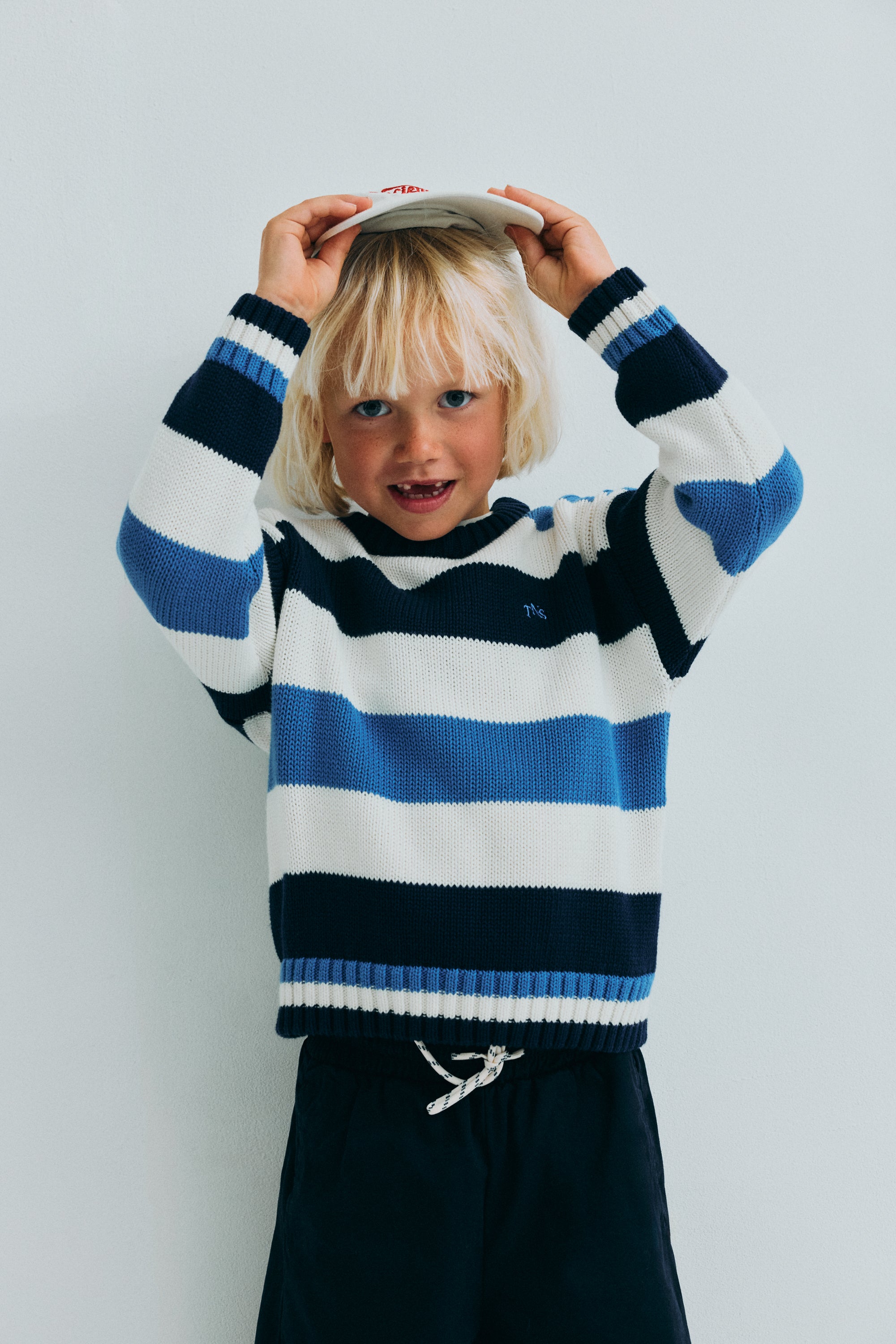 Our classic striped cotton knit featuring ribbed striped details that make this piece special and unique.