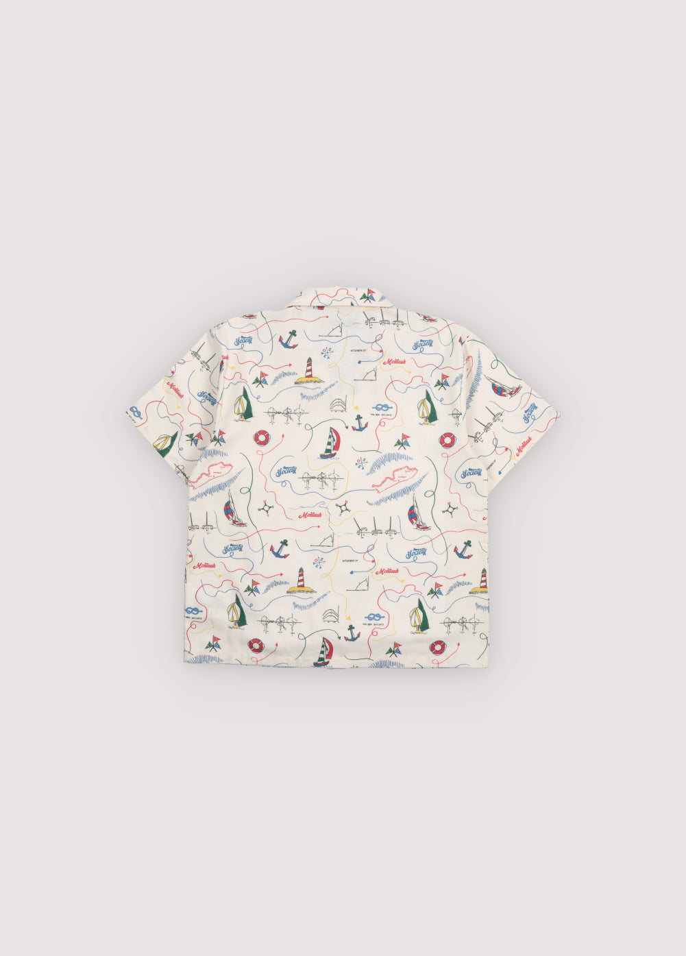 Short sleeve shirt in&nbsp;soft cotton featuring a unique multicolor map print and a front button closure with wooden buttons. 