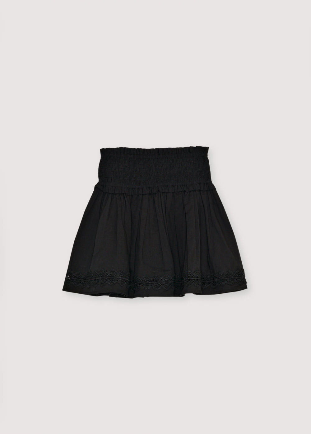 Cotton voile skirt with smocking detail at the top and a ruffled hem with lace trim. Perfect for pairing with the matching blouse. 