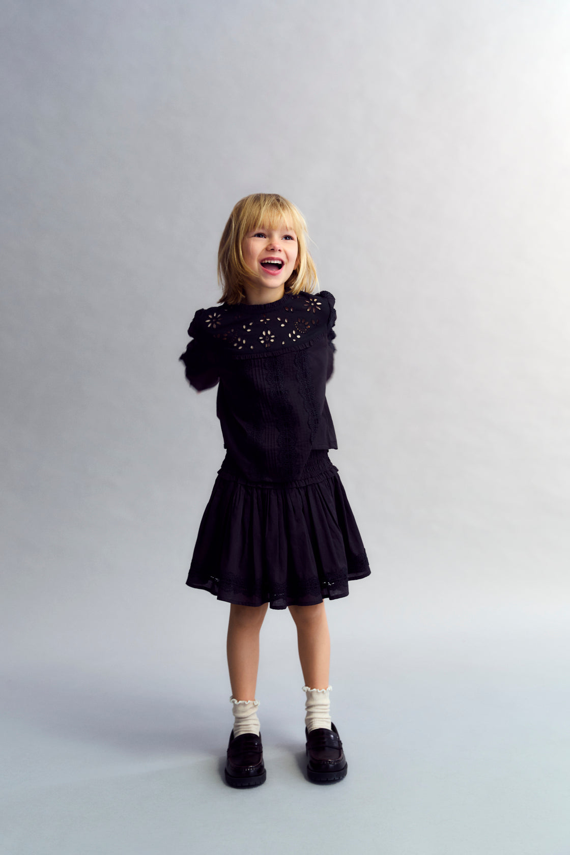 Cotton voile skirt with smocking detail at the top and a ruffled hem with lace trim. Perfect for pairing with the matching blouse. 