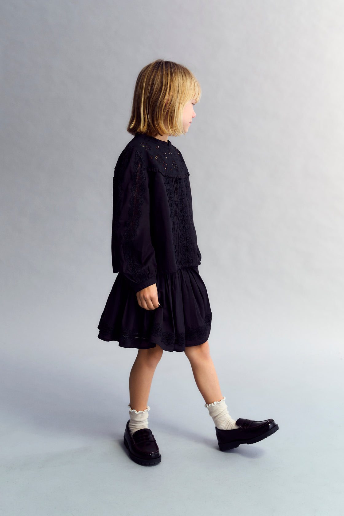 Cotton voile skirt with smocking detail at the top and a ruffled hem with lace trim. Perfect for pairing with the matching blouse. 