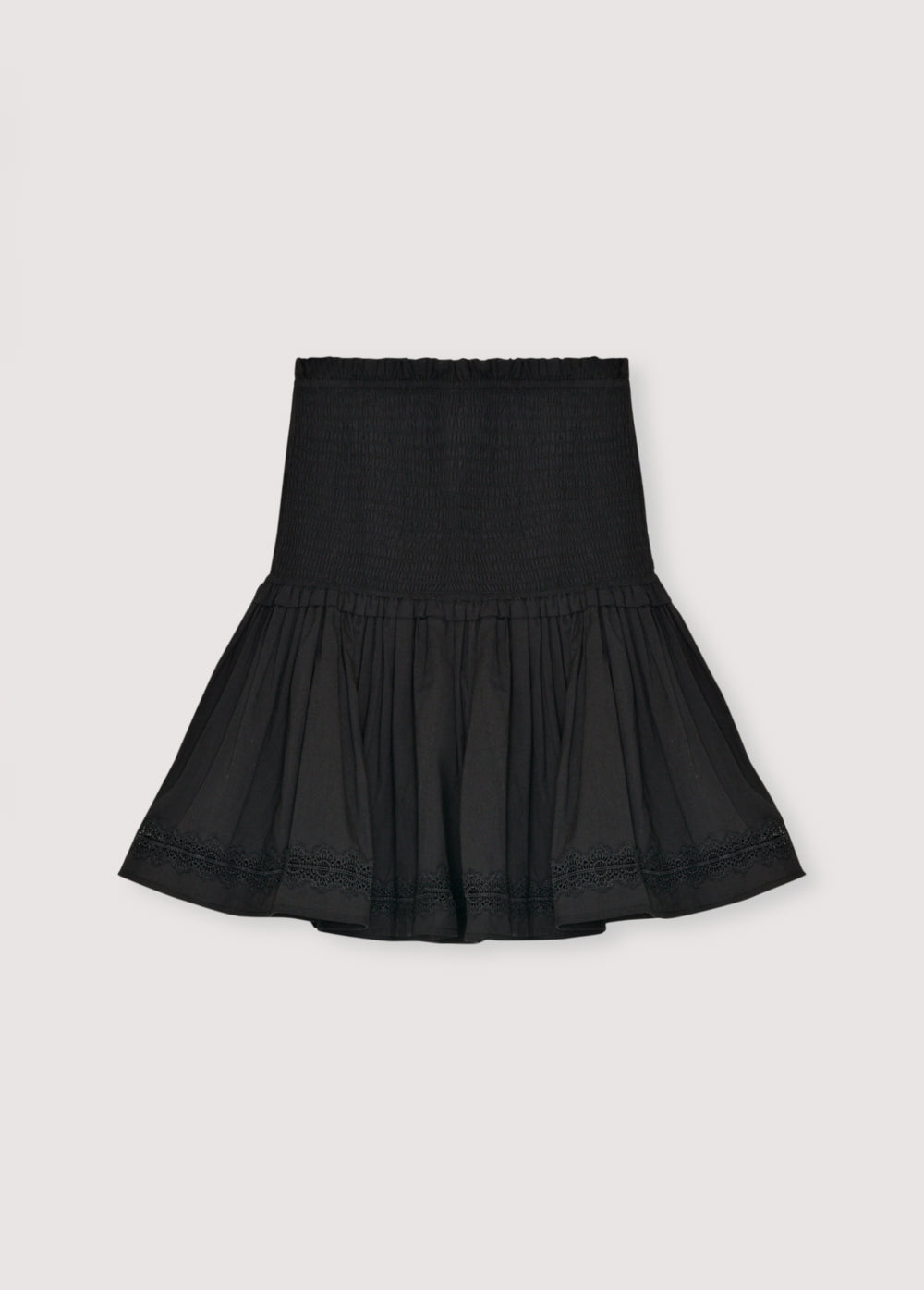 Cambric skirt with smocking detail at the top and a ruffled hem with lace trim. Perfect for pairing with the matching blouse.