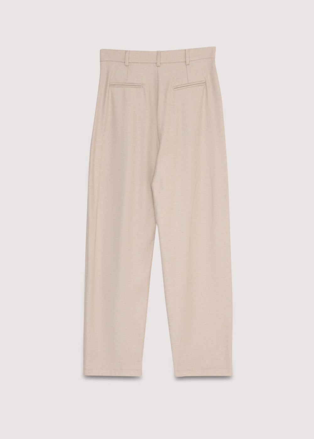 Wool pant with pleat detail in the front and side pockets. They feature a waistband with a hidden button closure.