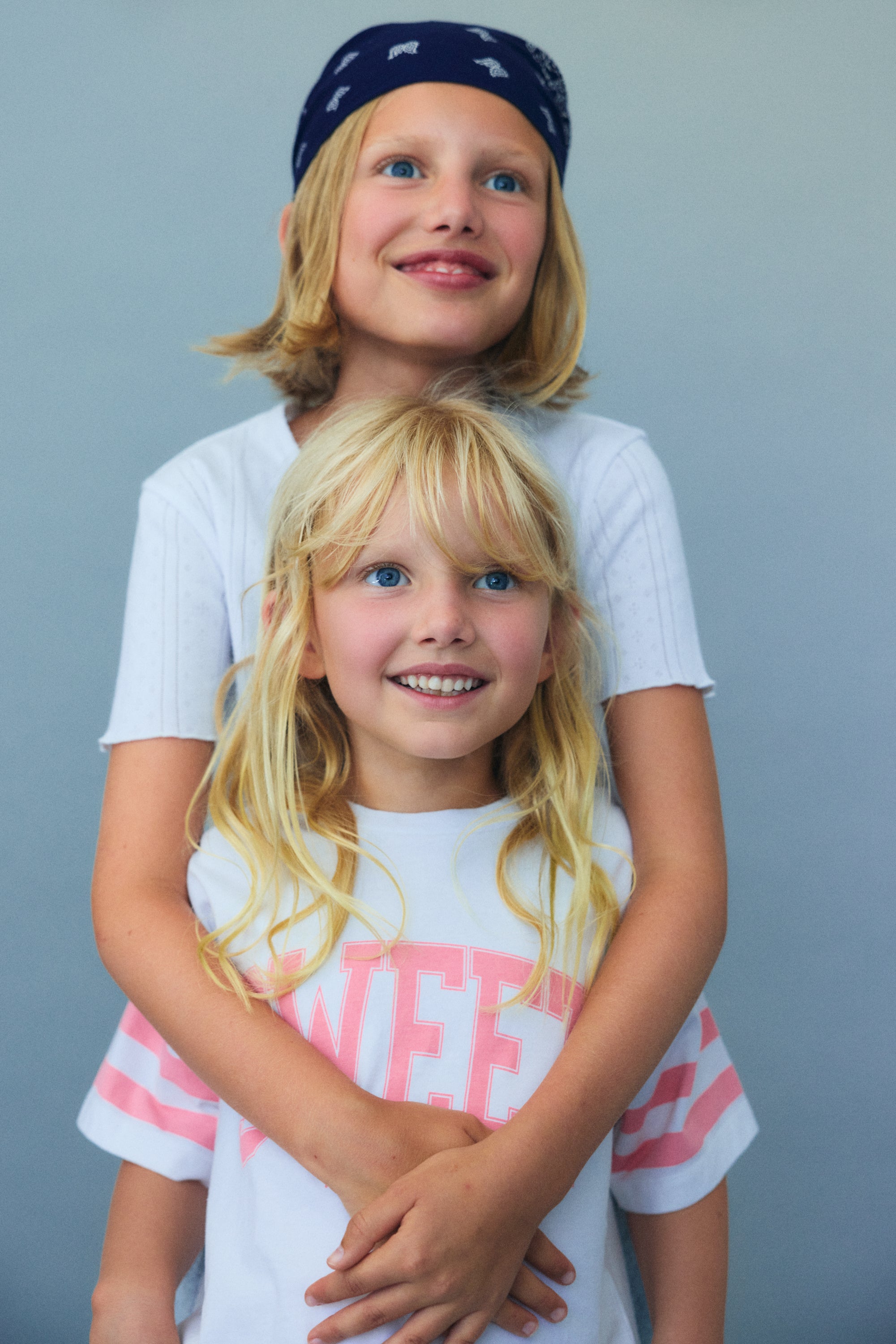 Soft cotton jersey crop tee featuring contrast prints on the sleeves and a “Sweet” print on the front for a playful, modern look.