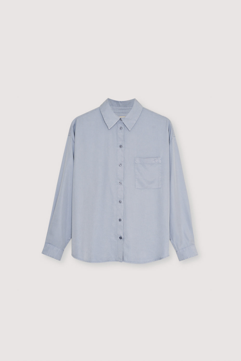 Shirt made from 100% lyocell for a soft, lightweight feel and a smooth drape. Designed with buttoned cuffs, a front patch pocket, and a front closure with tone-on-tone buttons for a clean, modern look. Available in three versatile colors to suit any style.