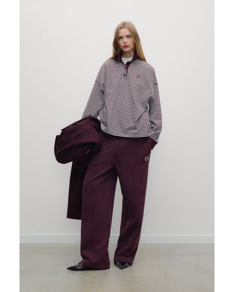 The Ona Woman Polo reimagines the timeless rugby-inspired silhouette with a fresh feminine attitude.