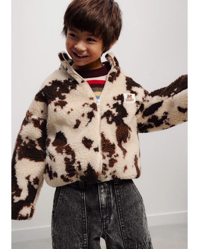 The Wynn Jacket is a playful take on the classic sherpa jacket, crafted from soft 100% cotton and finished with an eye-catching cow print