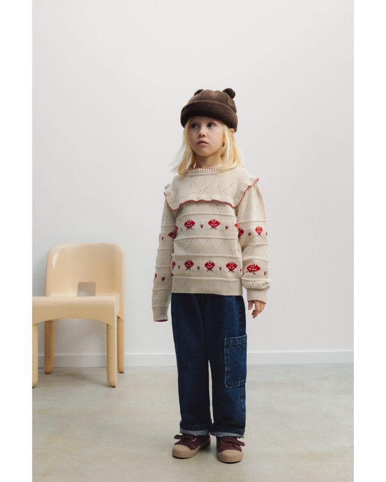 The Kaia Jumper is a beautifully crafted knit made from a soft wool and cashmere blend, combining delicate detailing with a playful, feminine feel. 