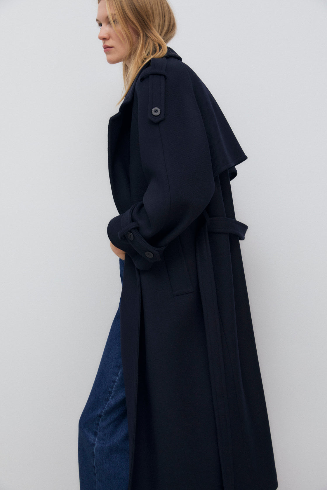 One of our best-selling coats, now in a new version made from high-quality wool. It's a long, double-breasted coat with a matching fabric belt.