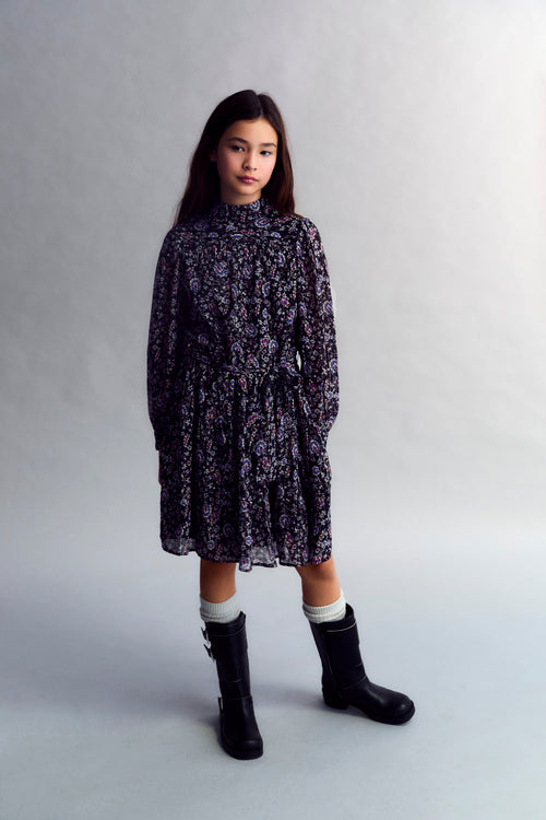 Short dress in viscose fabric with lurex and a printed design. It is fitted at the waist and features pleat details at the front. The skirt is voluminous with a ruffled hem.