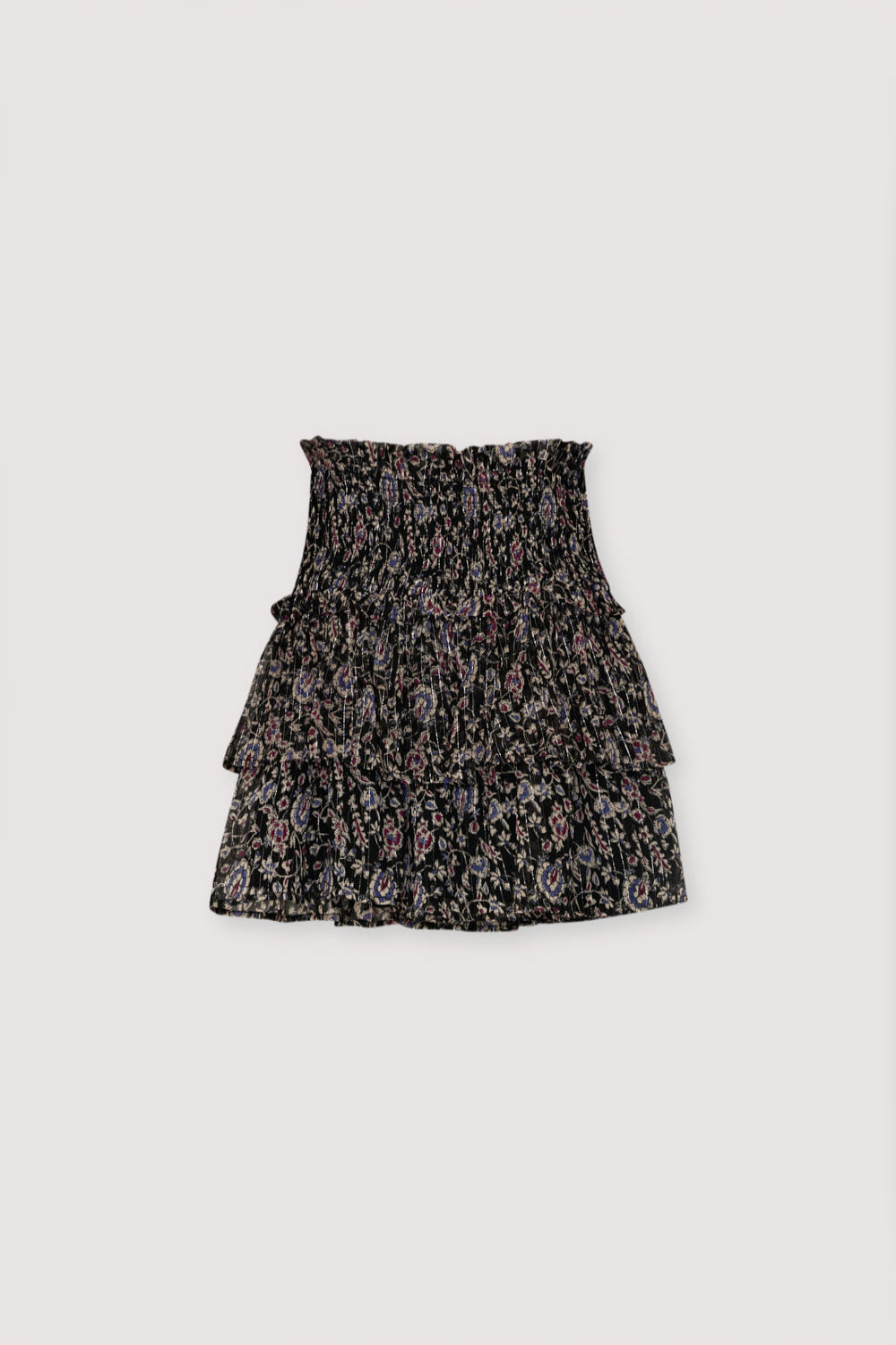 Viscose skirt with lurex and a print design. It features smocking detail at the top and a double ruffled hem.