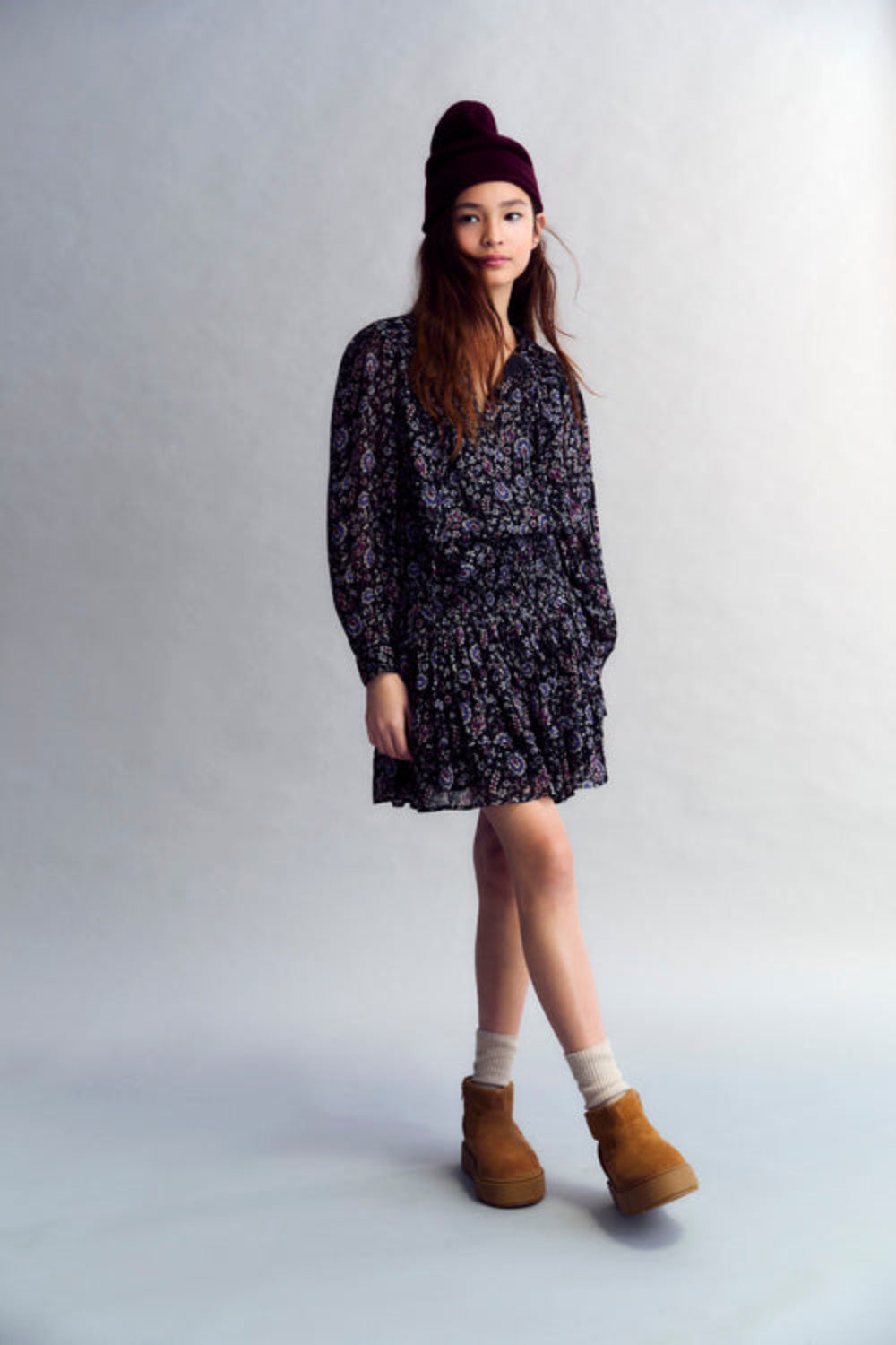 Viscose skirt with lurex and a print design. It features smocking detail at the top and a double ruffled hem.