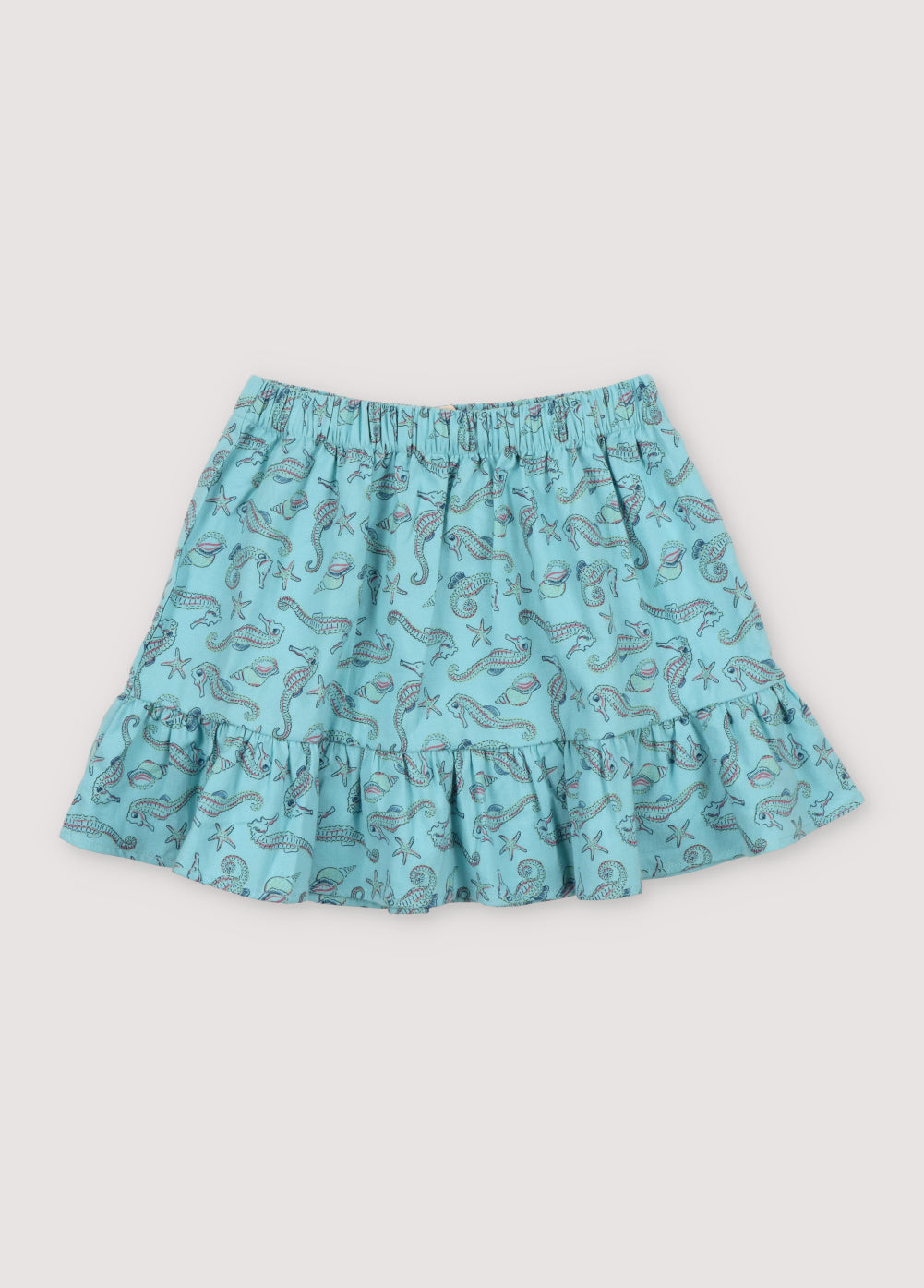 Io Skirt in 100% cotton fabric with our seahorses print, featuring an elastic waistband and a cut to generate more volume in the ruffle.