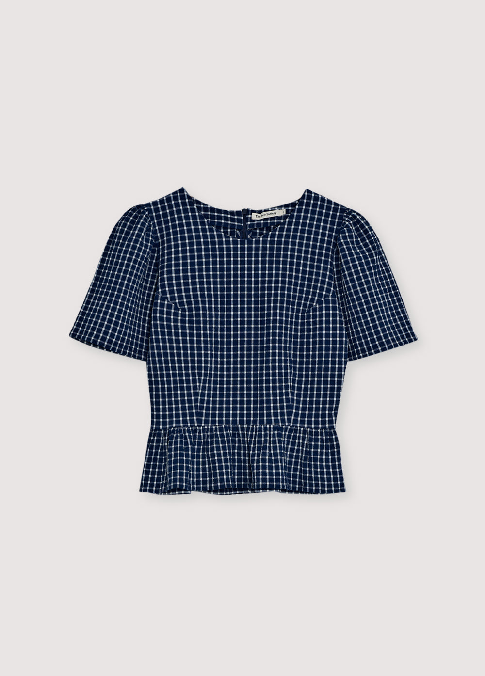 Crafted from soft cotton seersucker, this blouse features a charming gingham check, cut-and-ruffle details, and voluminous gathered sleeves