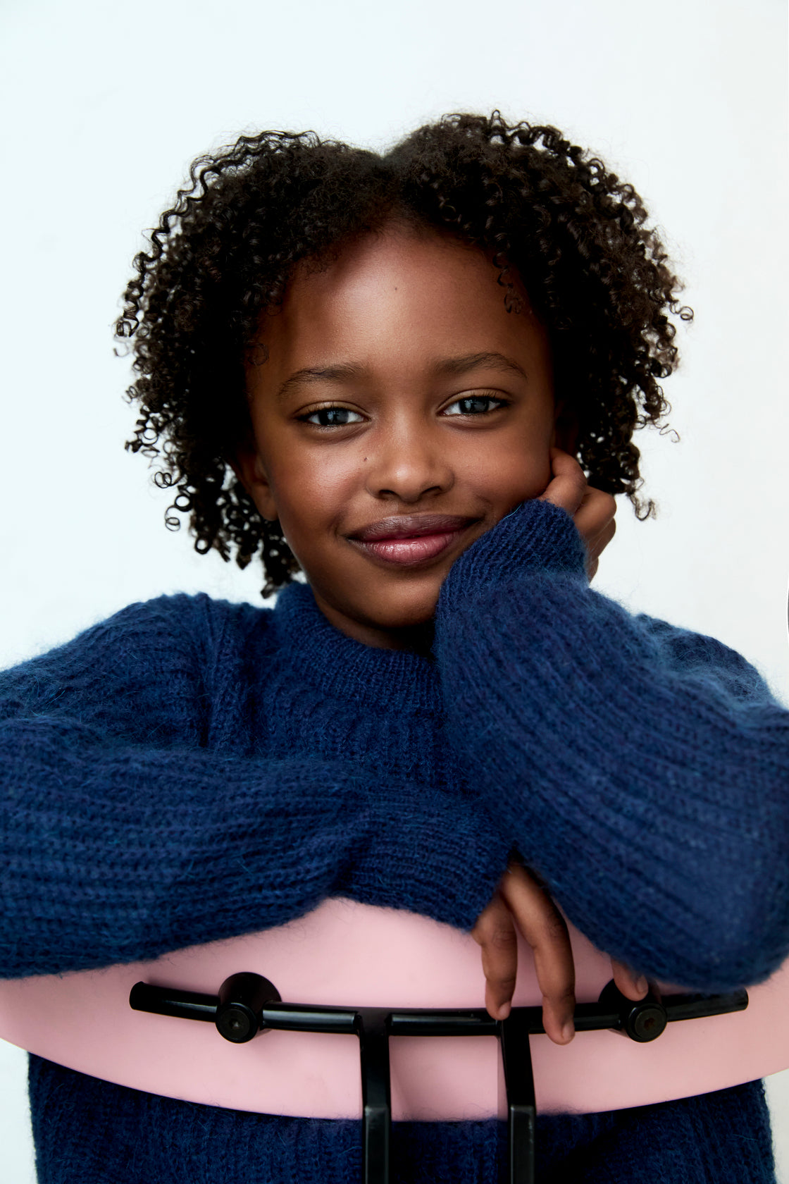 Fine rib knit mohair sweater with a round neckline and ribbing at the neck, cuffs, and hem.  It feautures a TNS embroidery on tone on hem rib.