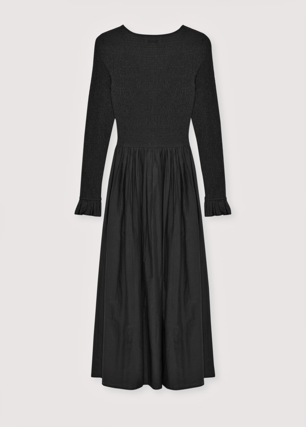 One of our best-selling dress styles, made from high-quality cambric fabric with a smocked bodice and V-neckline. Available in two colors.