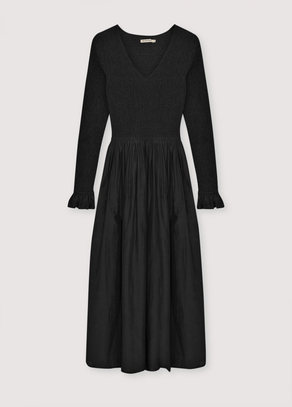 One of our best-selling dress styles, made from high-quality cambric fabric with a smocked bodice and V-neckline. Available in two colors.