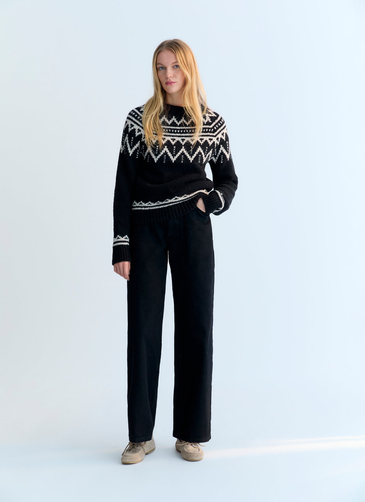 Wool sweater with a beautiful jacquard contrast detail on the front, back, and sleeves.