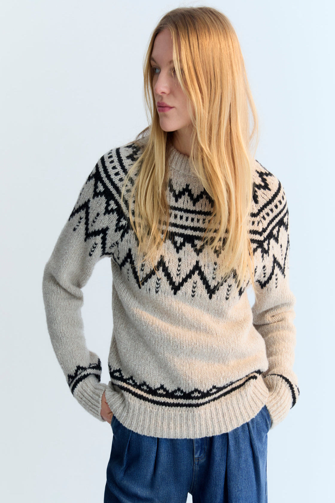 Wool sweater with a beautiful jacquard contrast detail on the front, back, and sleeves.