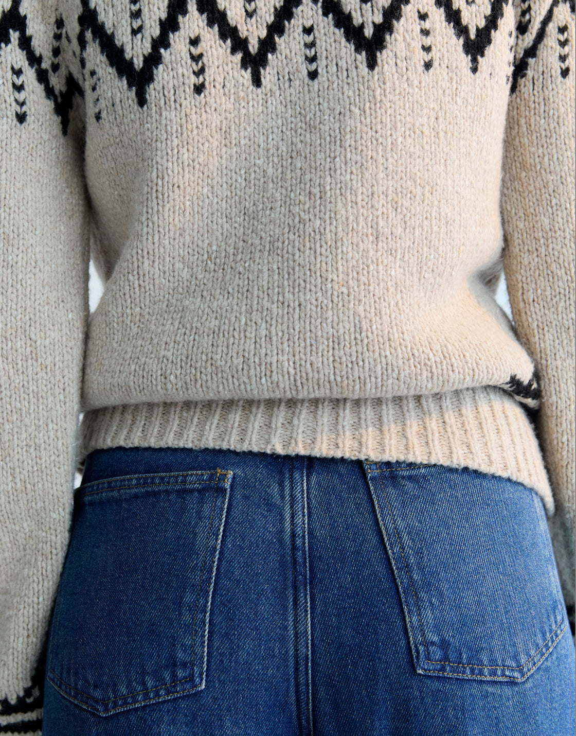 Wool sweater with a beautiful jacquard contrast detail on the front, back, and sleeves.