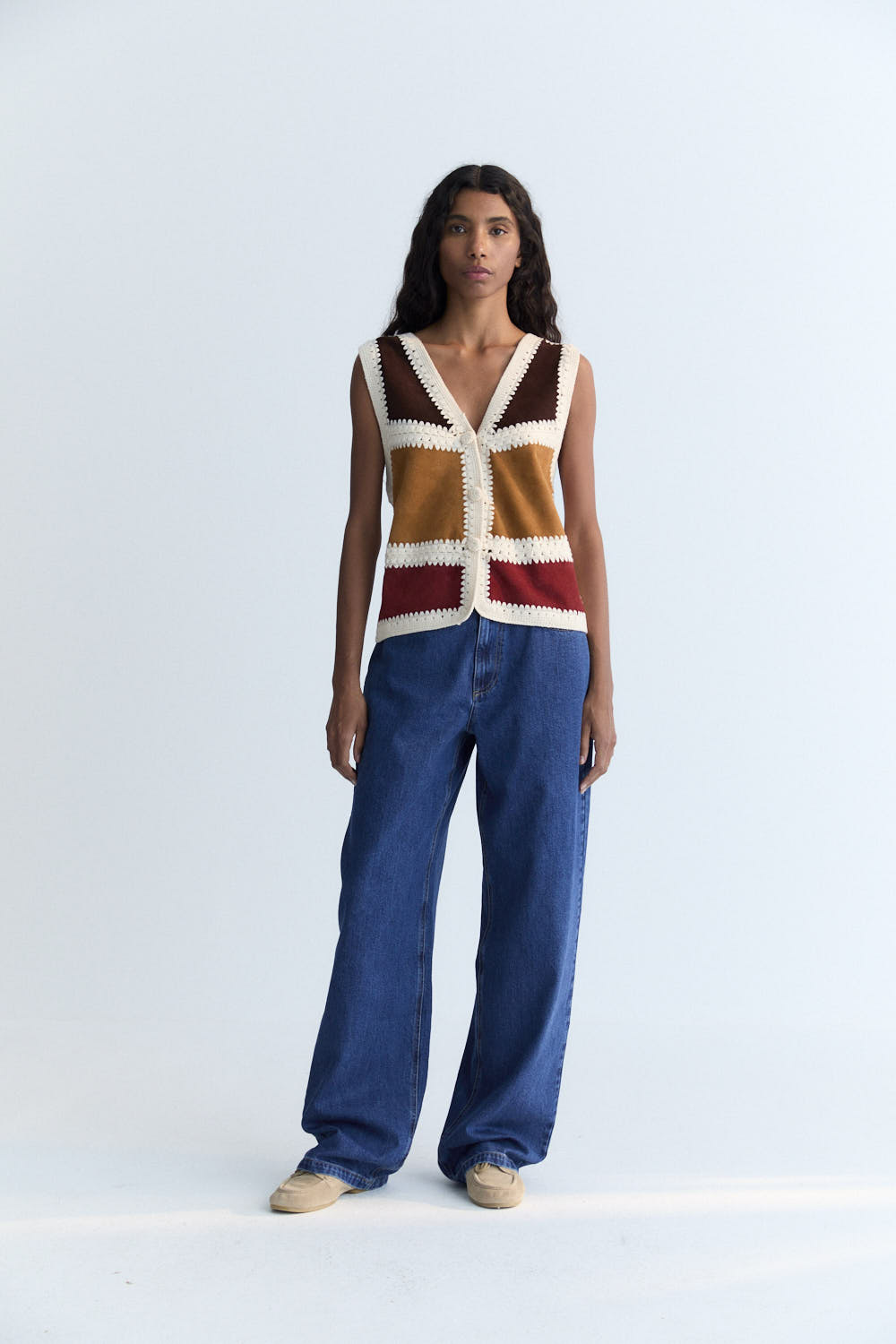 This vest is a special piece made in Spain, crafted from leather in various colors and handwoven wool crochet. A perfect piece to pair with the matching skirt.