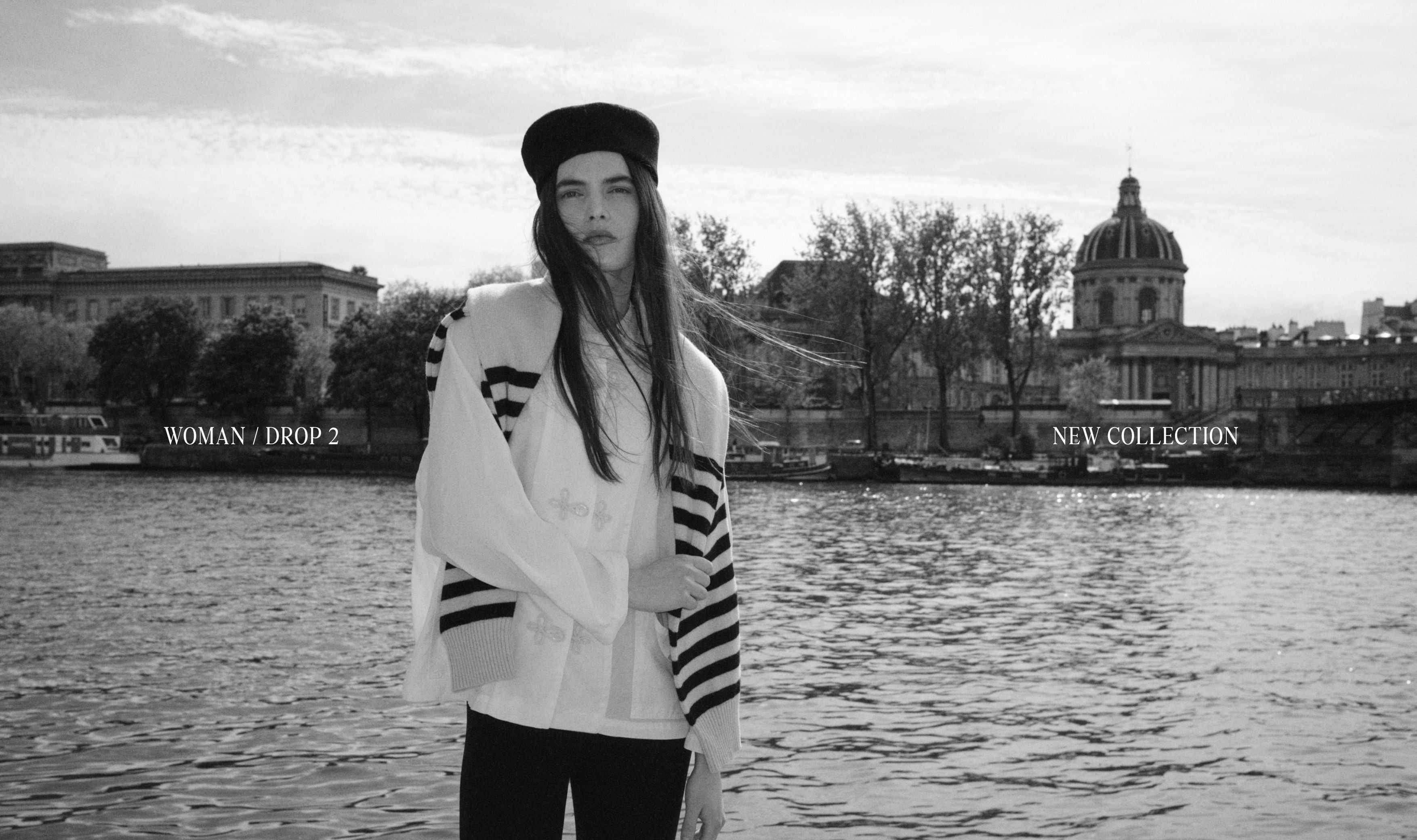 A black and white fashion photograph of a woman wearing a total look from our new collection he journey