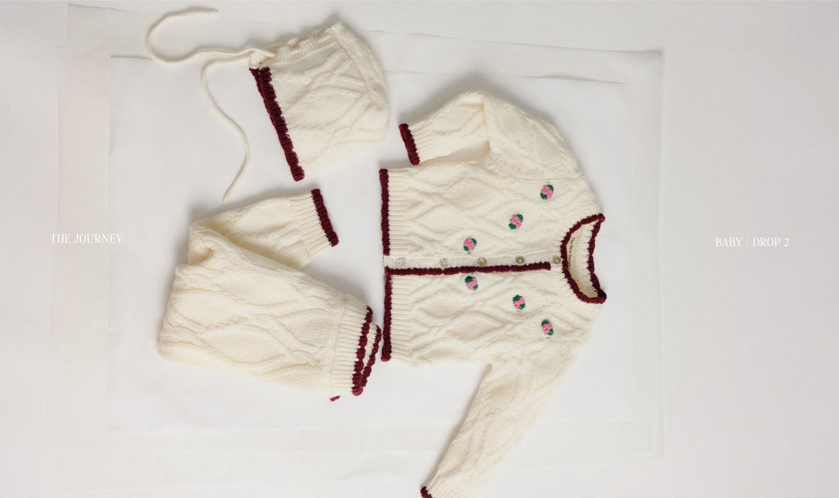 The Orla Baby Cardigan is crafted from a luxurious blend of cashmere, extrafine wool, viscose and polyamide, offering exceptional softness, warmth and everyday comfort