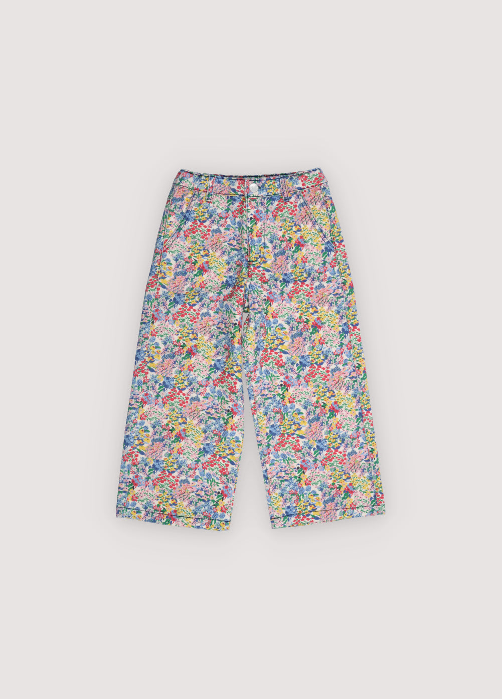 Wide leg denim pants featuring a beautiful flower print, straight legs, and an adjustable waistband with interior elastic