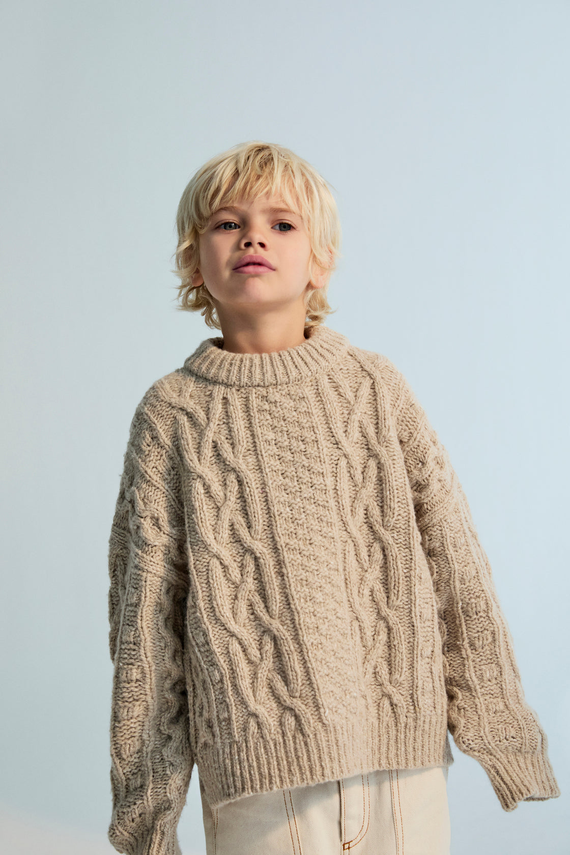 One of our classic knit patterns, this time crafted in recycled wool quality with a new textured knit design.