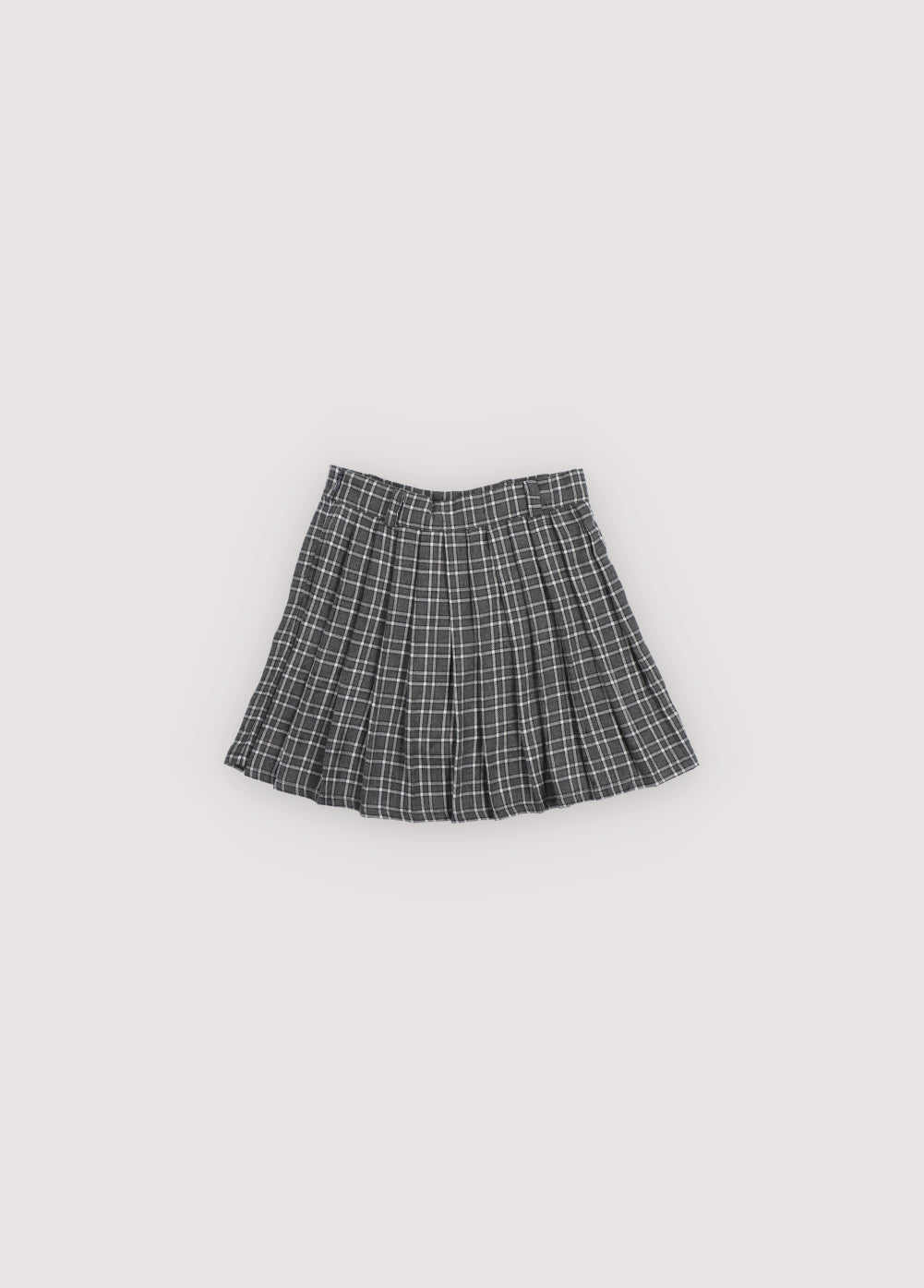 A chic pleated skirt featuring a comfortable inner pant lining for ease of movement. Designed with a fitted waistband, belt loops, and a tonal side zipper for a clean, refined finish.
