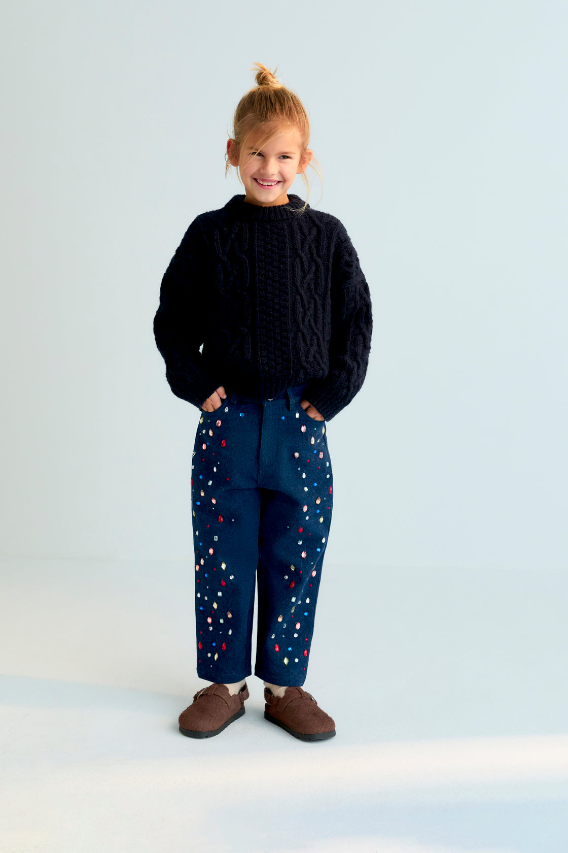 Dark denim pants with hand-applied multicolor crystal details on the front. TNS embroidery in lurex. Perfect to combine with the matching jacket.