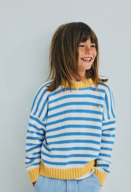 Classic cotton knit sweater featuring fine two color stripes and contrasting rib details on the collar, cuffs, and hem.