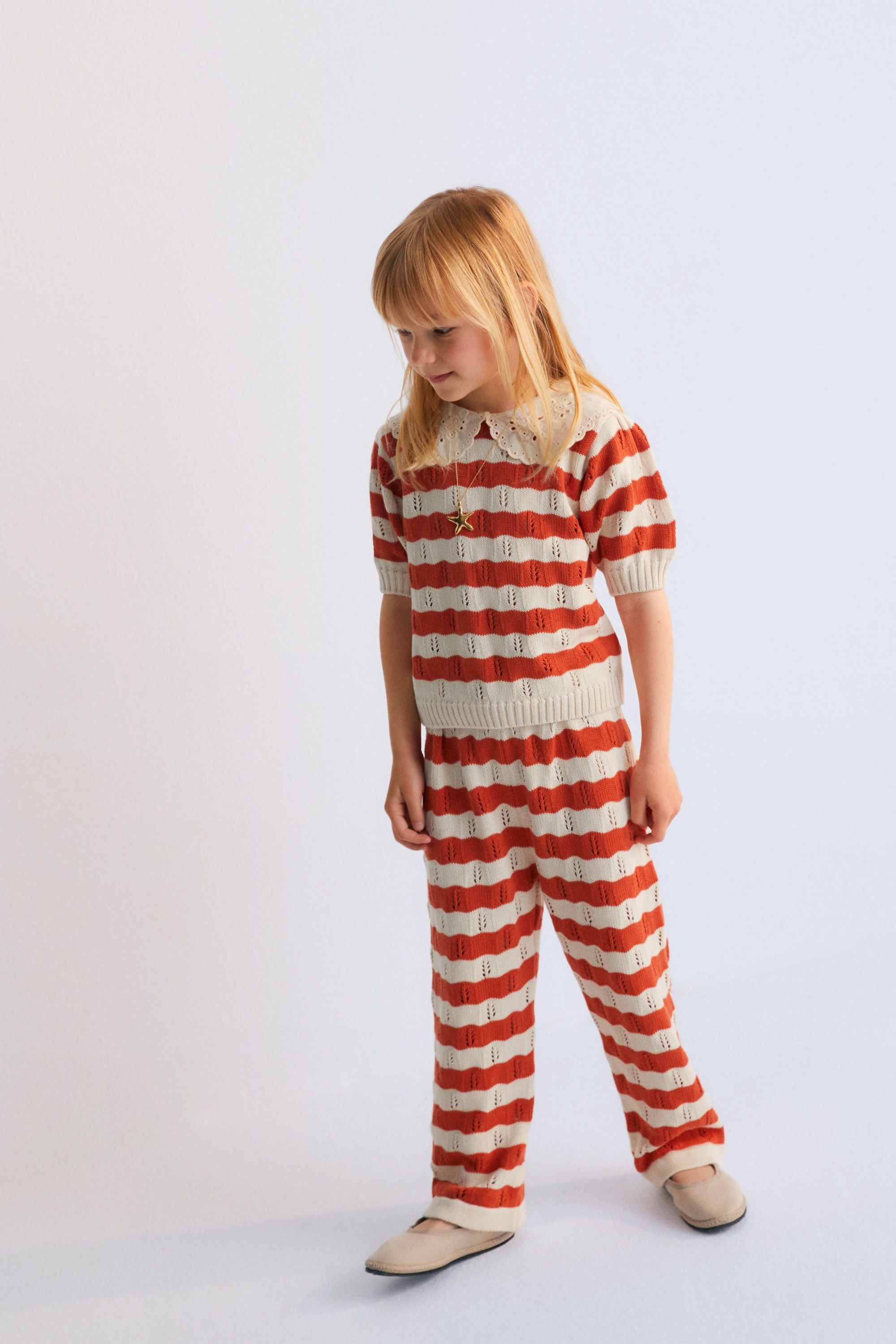 Bicolor striped knit pant with ribbed elastic waistband. It's a perfect garment to create a fun look with the matching jumper. Spring Summer Collection. The New Society. 